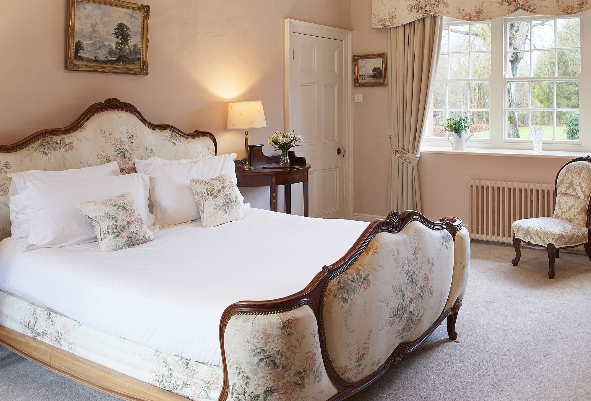 Melmerby Hall ensuite Master Bedroom with six foot superking bed overlooking the gardens luxury holiday property for family holidays large group gatherings weddings corporate retreats at The Rowley Estates