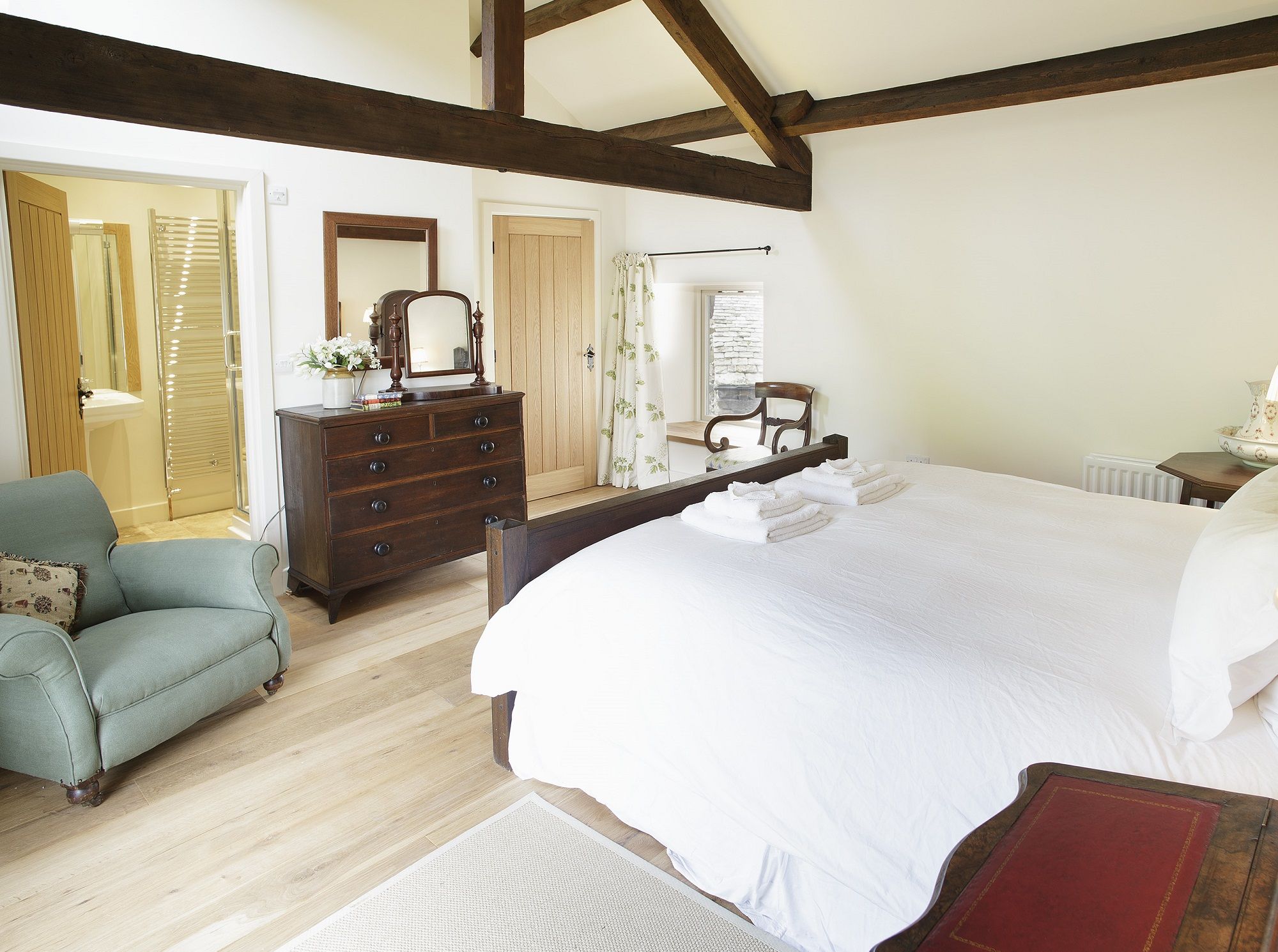 Hause Hall Farm Master Bedroom on first floor ensuite with shower and roll top bath holiday cottage in Lake District National Park at The Rowley Estates