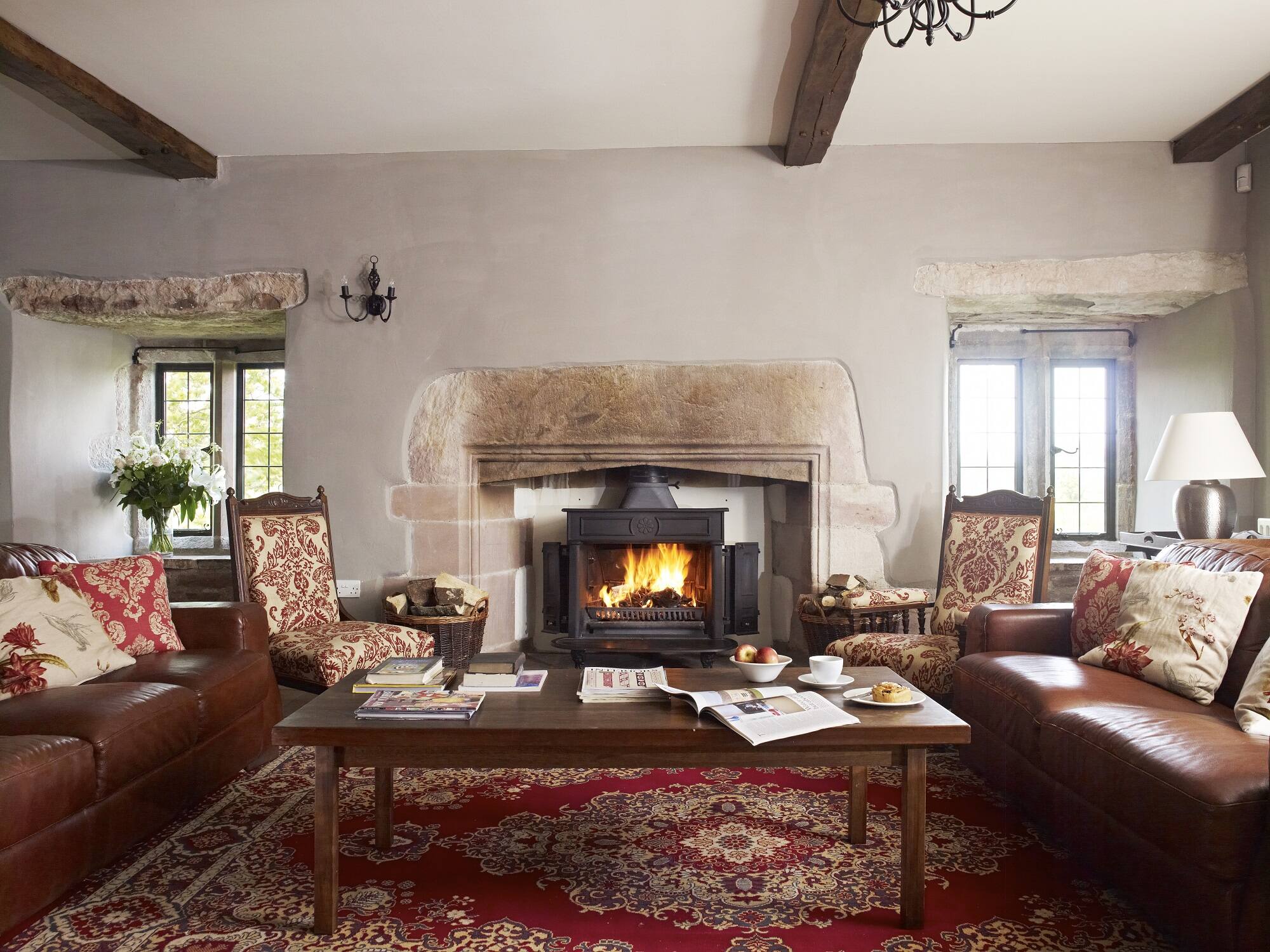 large-solar-reception-room-in-blencowe-hall-with-open-fire-luxury-holiday-rental