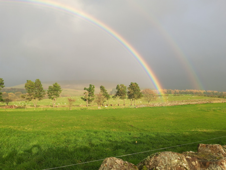 Double rainbow on the fellside above the village of Melmerby walkers welcome at The Rowley Estates holiday cottages