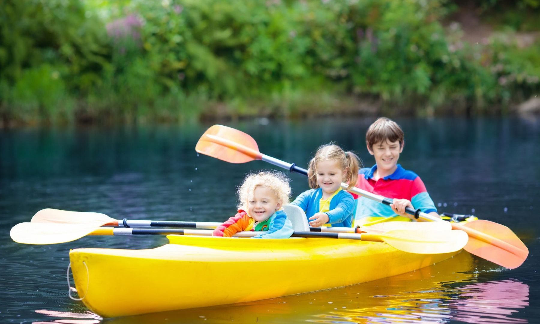 family-activities-child-on-kayak-on-lake
