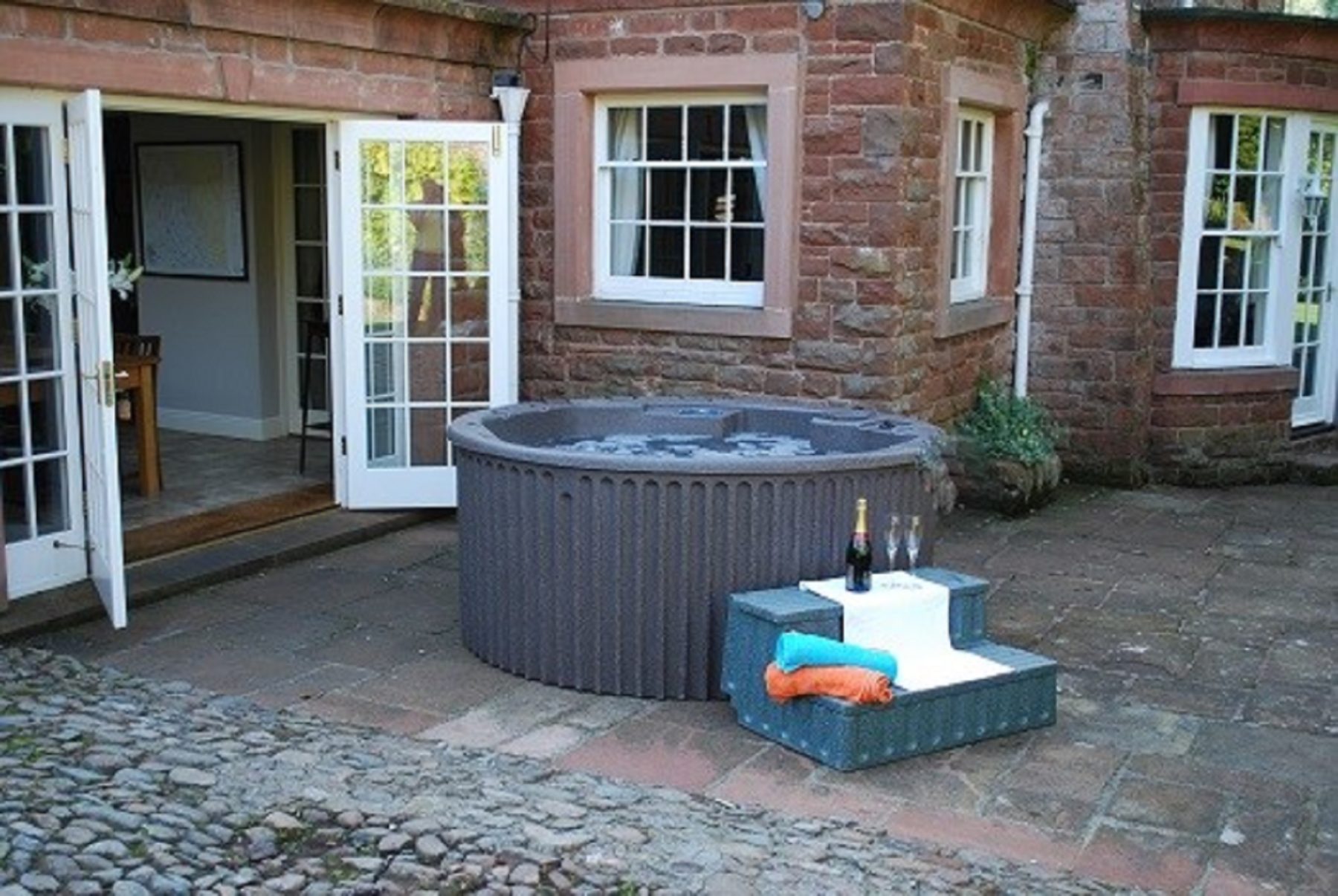 hot-tub-on-terrace-at-melmerby-hall-available-for-large-groups-lake-district-holidays