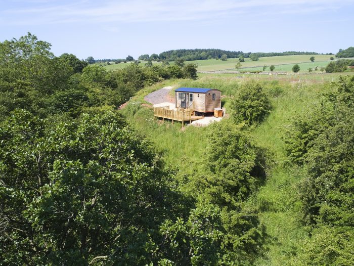 Hawthorn Shepherds Retreat overlooking the River Petteril private wooden deck and secluded woodland surrounding near Lake District National Park