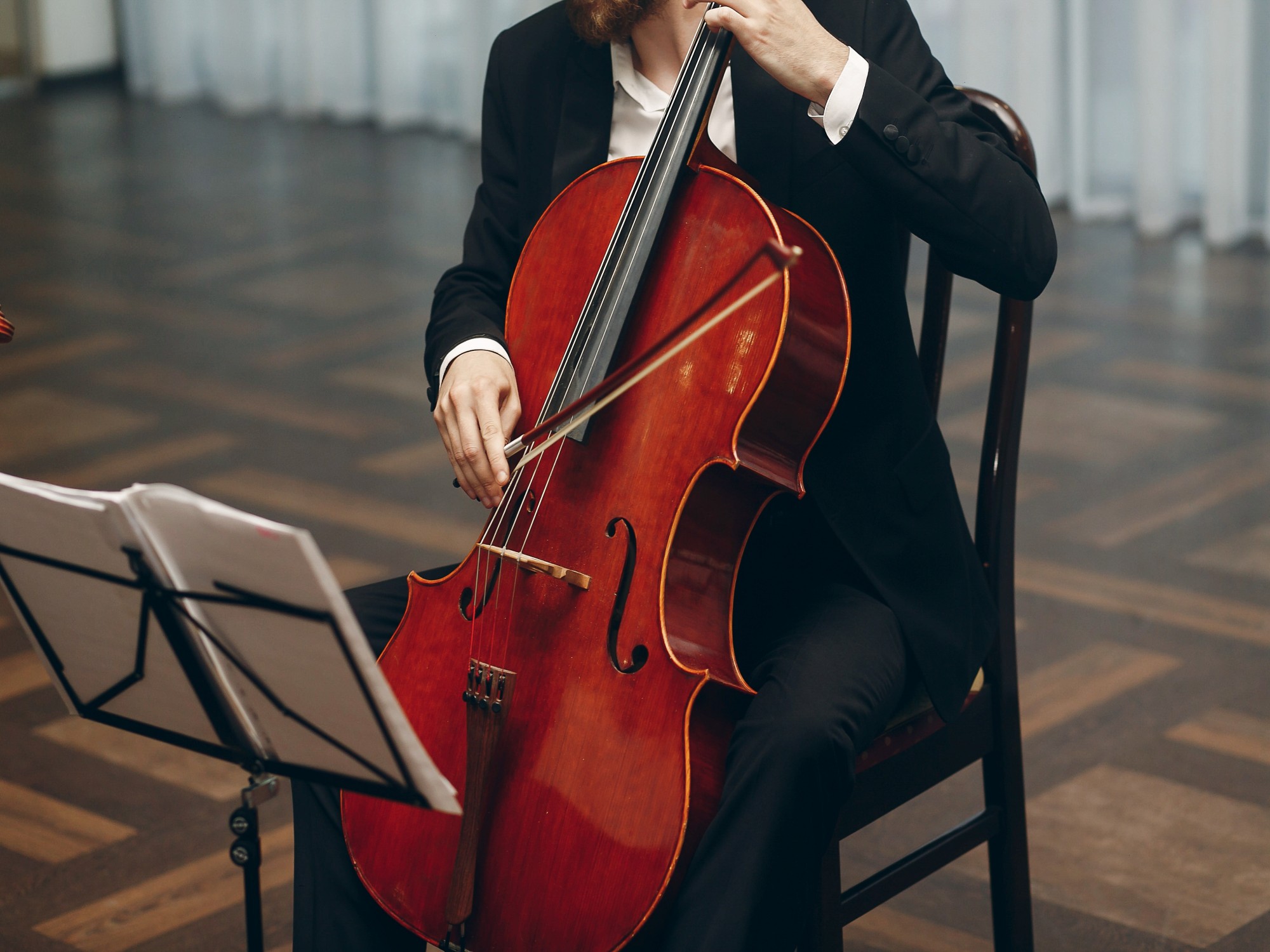 cello string quartet man playing instrument