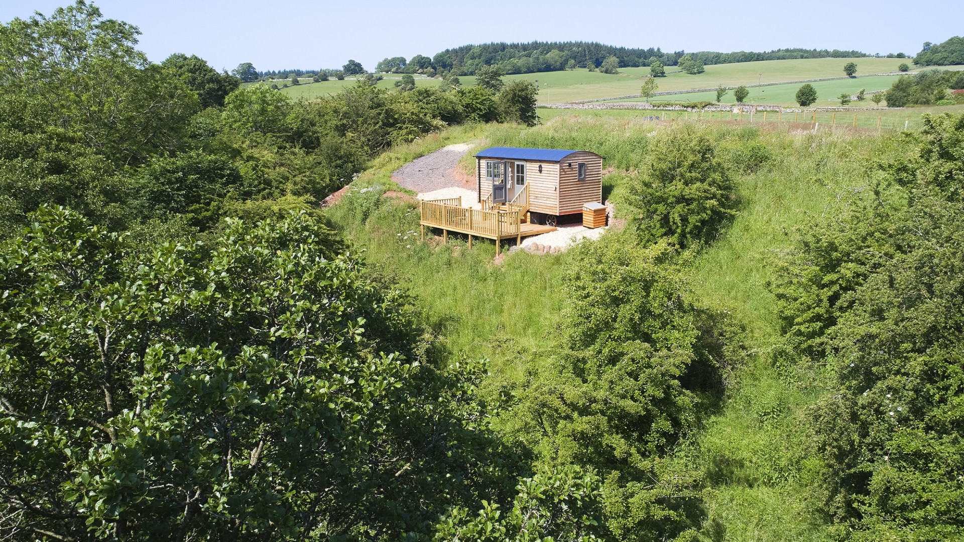 Hawthorn Shepherds Retreat overlooking the River Petteril private wooden deck and secluded woodland surrounding near Lake District National Park