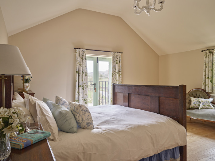 Gill Beck Barn Elterwater master bedroom ensuite with shower and bath holiday cottage at The Rowley Estates