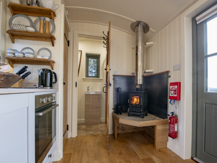 shepherds hut with ensuite shower room and cast iron log burner
