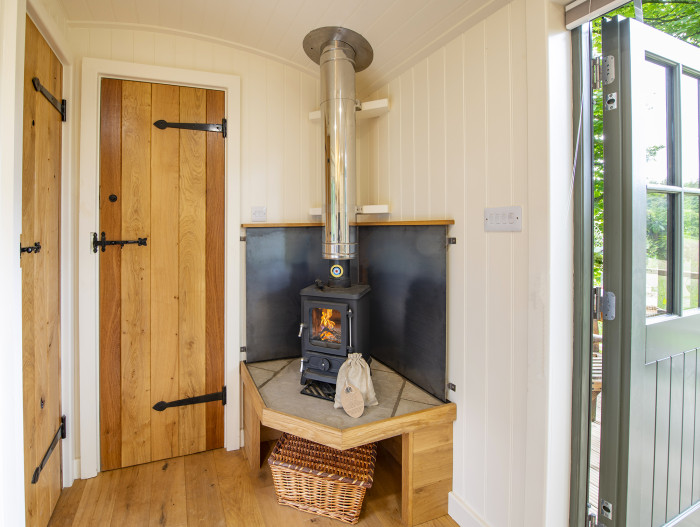 shepherds hut internal with cosy log burning stove
